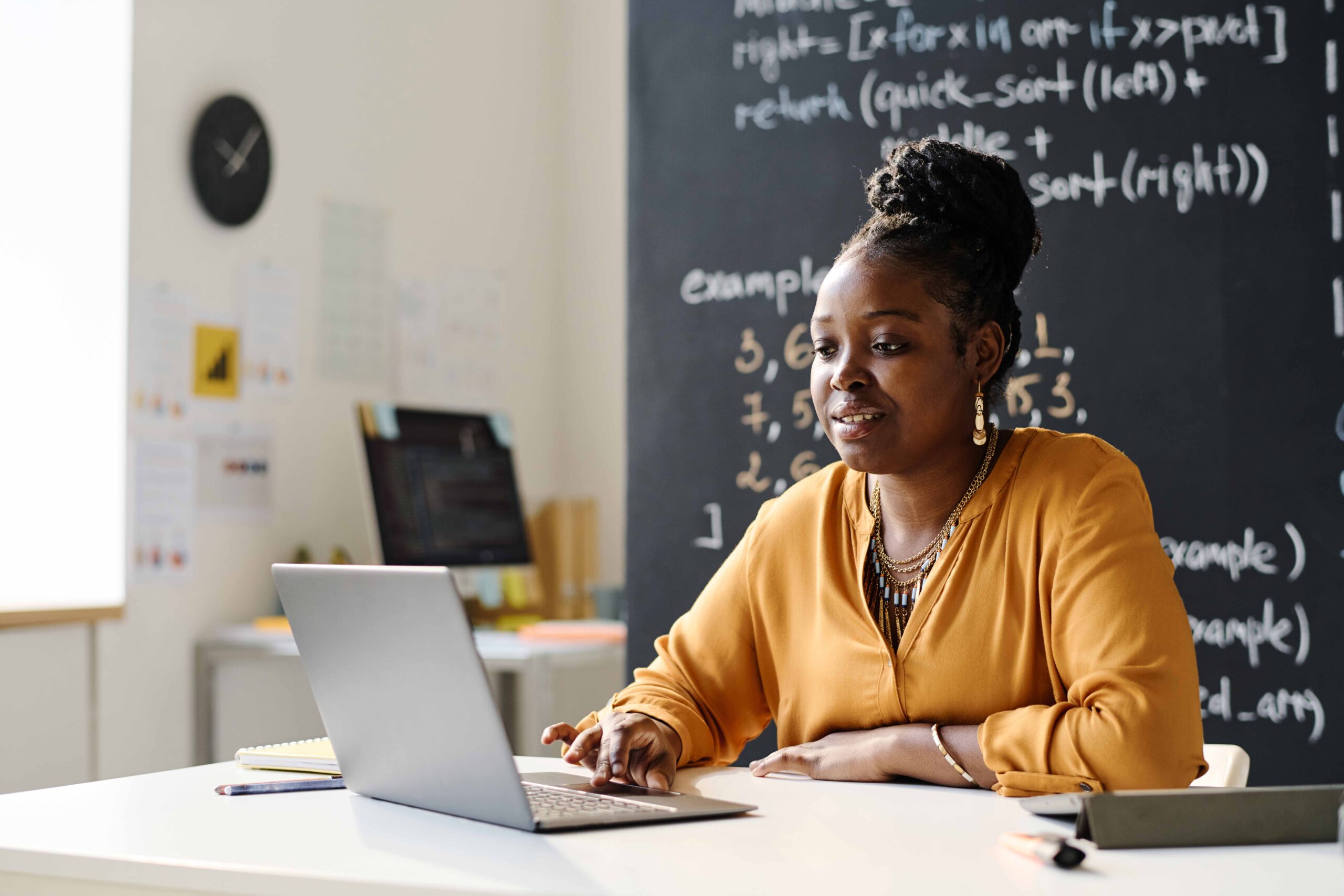 African-teacher-with-laptop